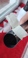 Removing the protective liner from a window film fragment