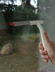 Removing dirt from glass before applying window film